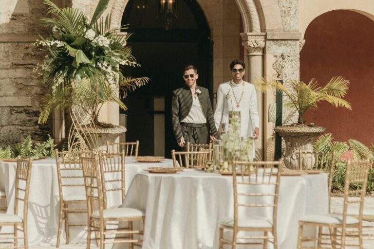 Grooms entering the reception site hand-in-hand before the wedding begins