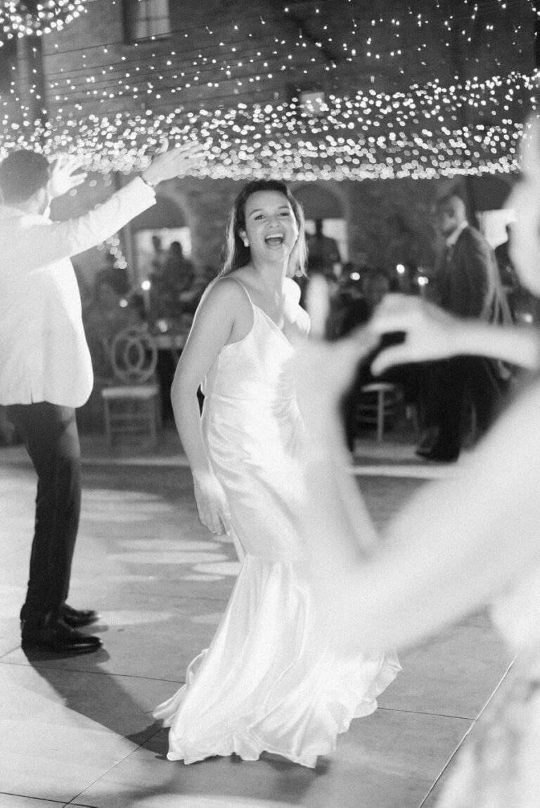 Newlywed couple enjoying dancing at Deering Estate's Courtyard