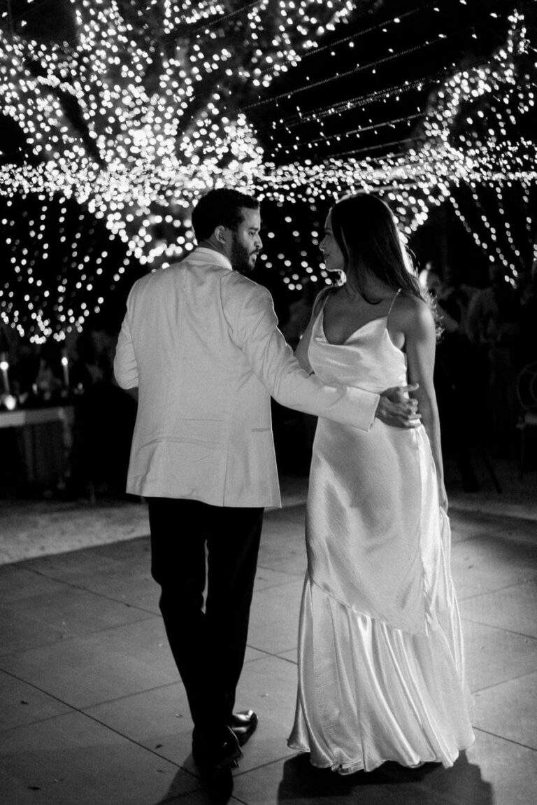 Couple during their first dance at Deering Estate's Courtyard, edited in black and white