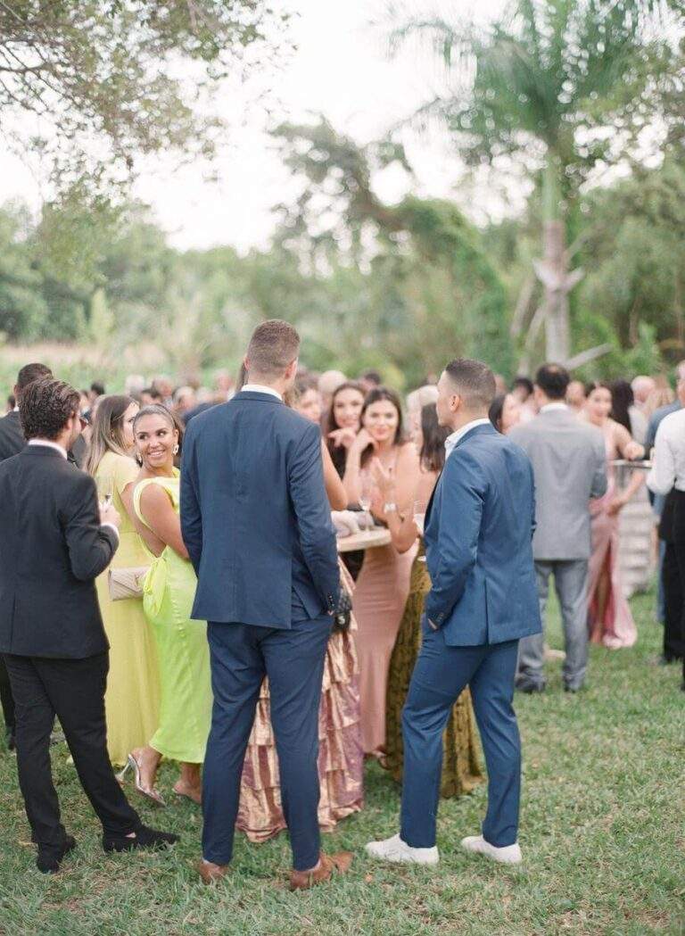 Wedding guests enjoying cocktail-hour near Deering Estate's Richmond Cottage lawn