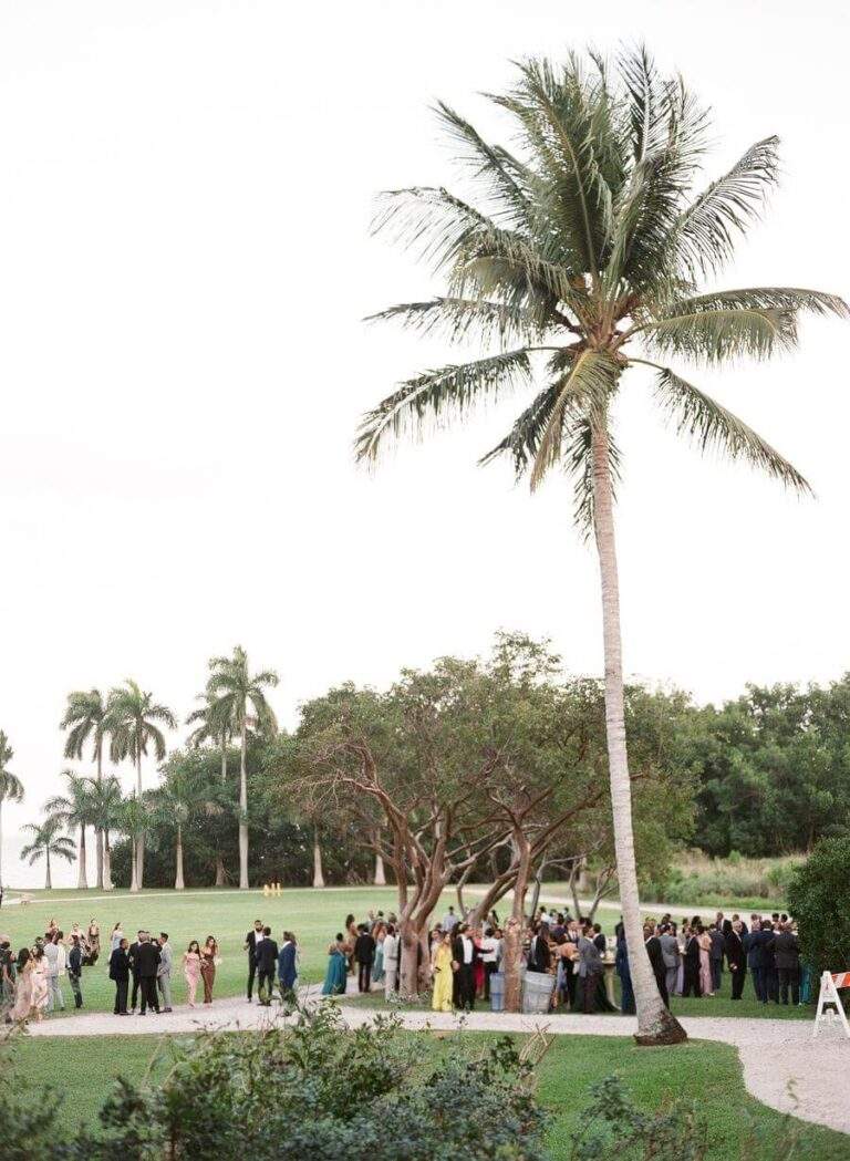 Wedding Guests enjoying cocktail-hour at Deering Estate's Richmond Cottage Museum's lawn