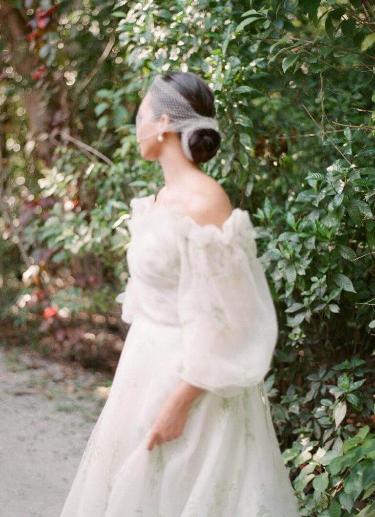 Bride at Deering Estate's lush garden pathway