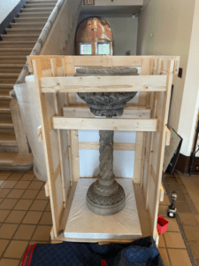 Custom-made crate that was built to hold a collection piece (a cement planter) for the Stone House Restoration Project.