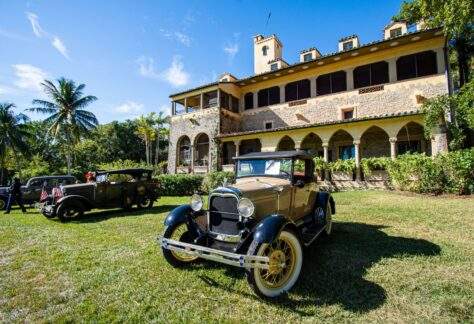 Vintage cars parked in front of the Stone House during the Annual Vintage Auto Show at Deering Estate.