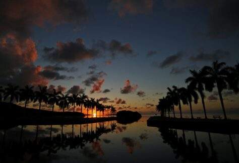 A view of the sun rising over Biscayne Bay at the Boat Basin Jetties at Deering Estate.