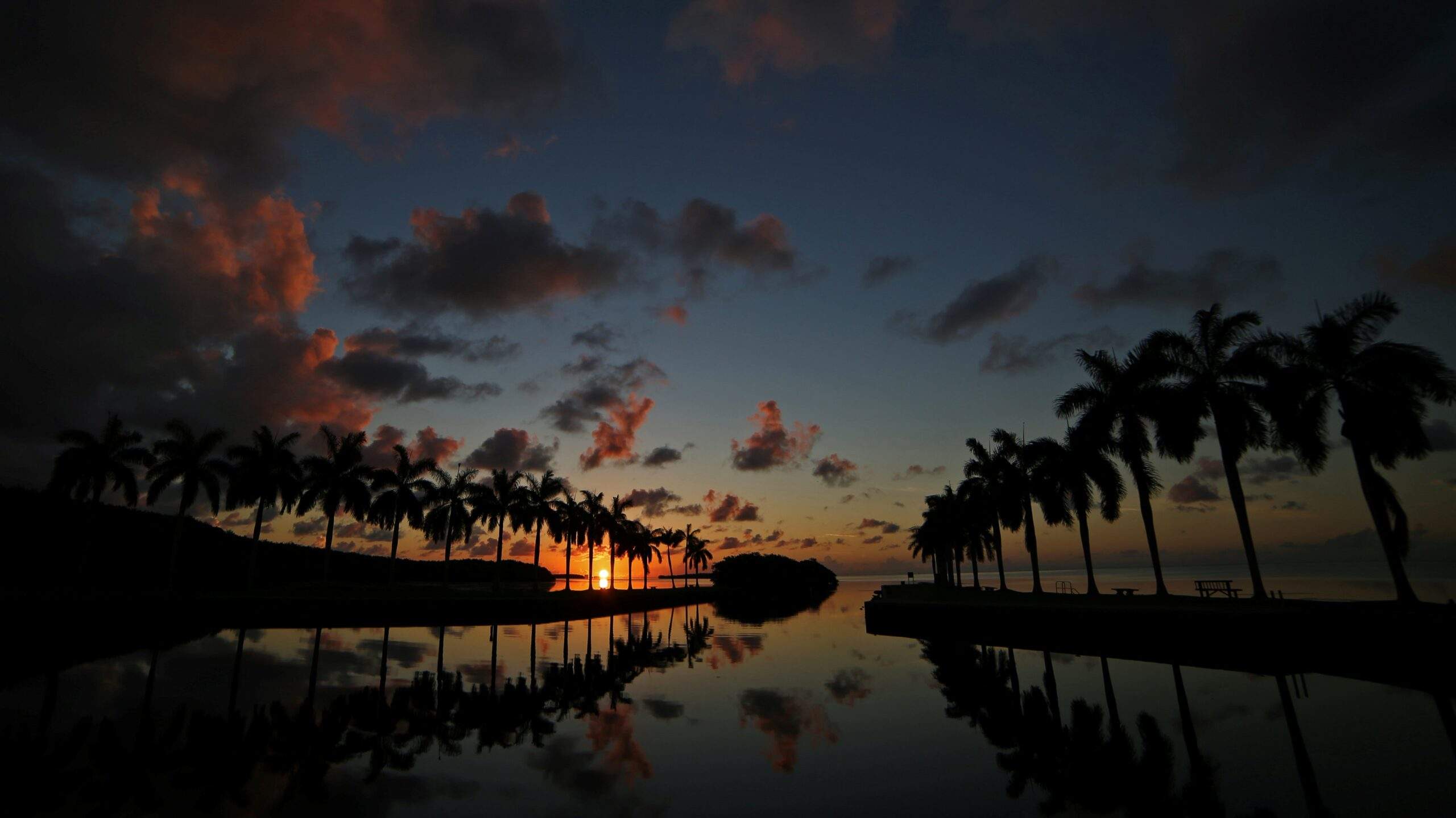 A view of the sun rising over Biscayne Bay at the Boat Basin Jetties at Deering Estate.