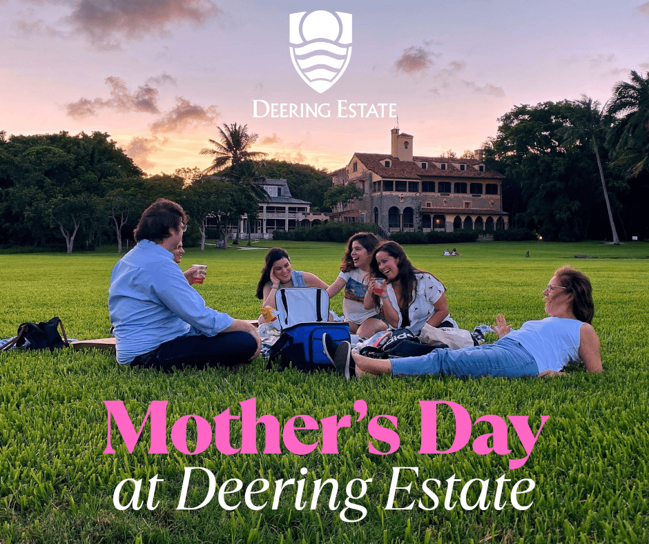 A mother, father, and four children enjoy a picnic on the main lawn of Deering Estate in front of the historic homes. The Deering Estate logo in featured on top of the image, and text at the bottom of the image reads "Mother's Day at Deering Estate."