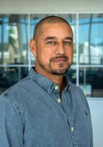 Headshot of artist Mark Herrera.