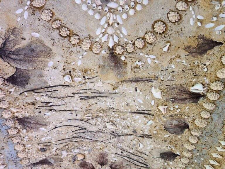 Beautifully detailed seashell mosaic on the ceiling of the Stone House walkway.