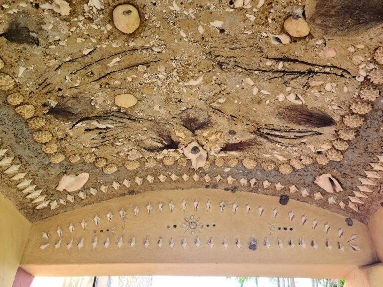 Beautifully detailed seashell mosaic on the ceiling of the Stone House walkway.